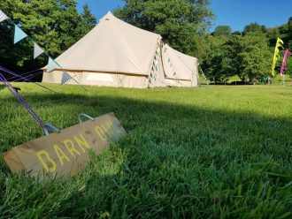 Bell tents set up for corporate booking with Fiesta Fields