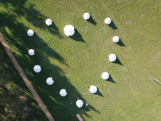 Bell tents set up in love heart shape