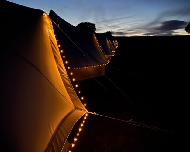 Bell tents pictures at night with LED fairy lights