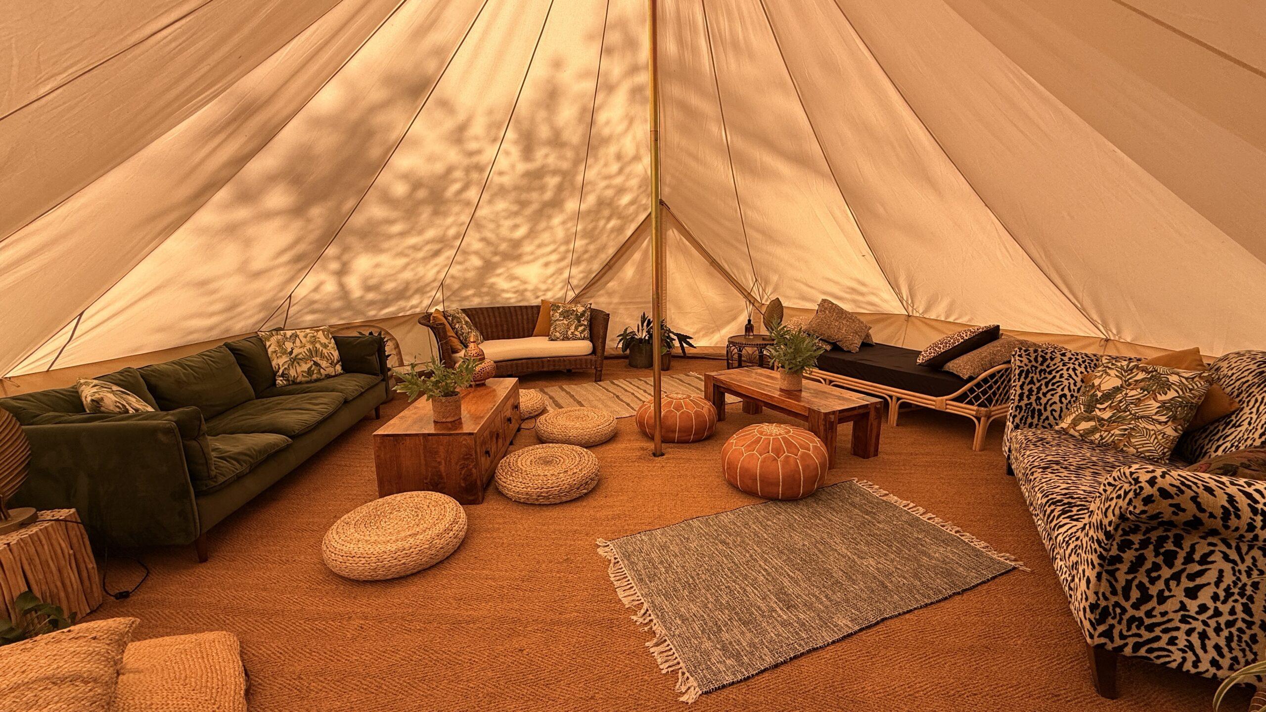 Interior of 7m bell tent at Hen Camp, showing a safari / Tribal theme