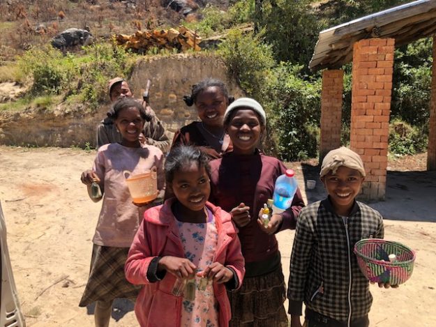 Children selling home made essential oils by the roadside in Madagascar. 