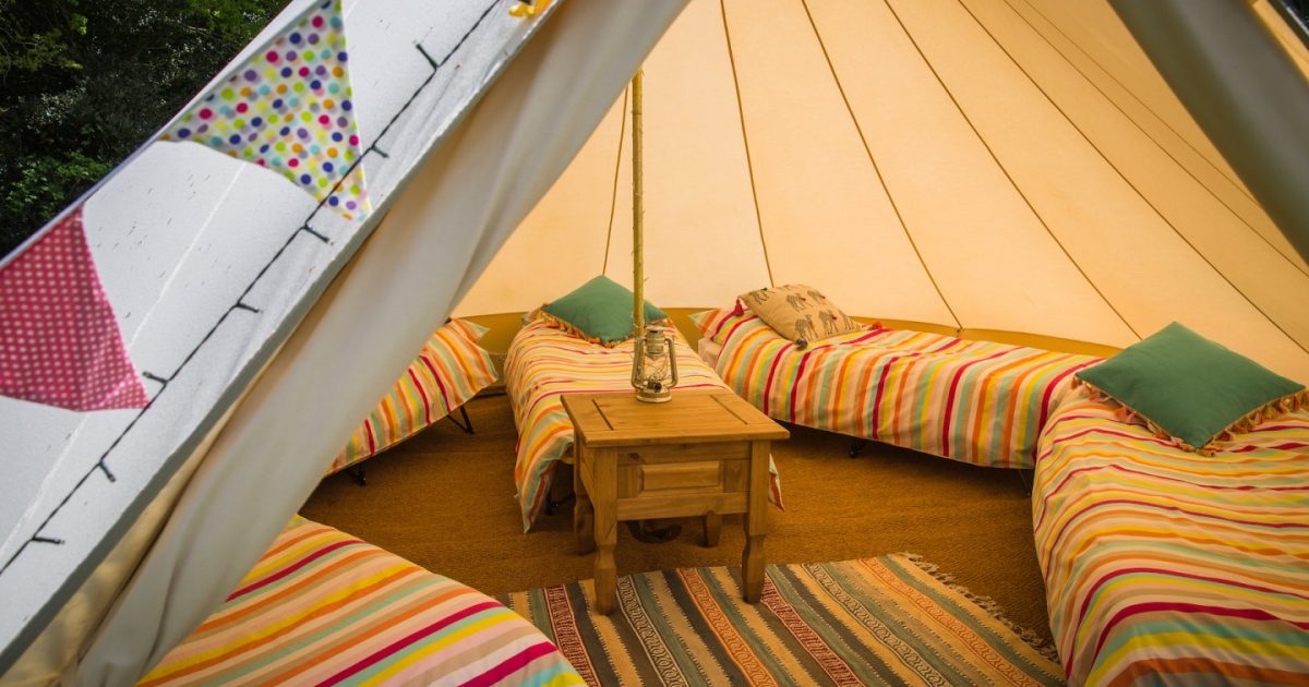 Interior shot of one of our sleeping tents at hen camp. Exclusive hen party bell tent hire in Hampshire, Dorset and the New Forest