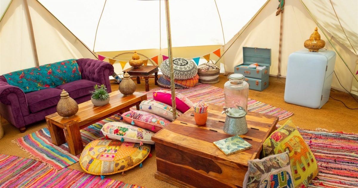 Beautiful Bells Hen Camp 22 Interior picture of 7m chill out bell tent for 2018 / 2019 season. Hen camp chill outsells come with plenty of soft furnishing and give you a communal space to celebrate your hen party weekend!