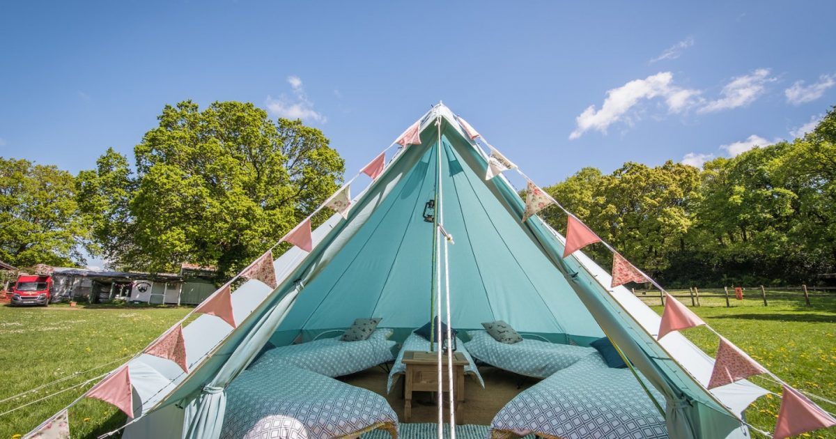 Beautiful Bells Hen Camp 1 Blue bell tent in our Tropic camp area for hen party glamping weekends in the New Forest