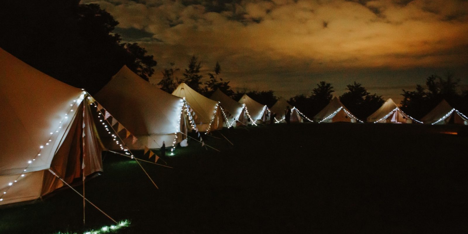 Bell tent village at night in Oxford