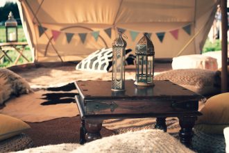 Beautiful Bells 7m chill out bell tent, decorated with cushions and tables